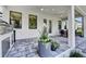 This outdoor kitchen features a built-in grill, gray stone floors, and a ceiling fan at 1821 Windsor Dr, Winter Park, FL 32789