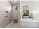 Beautiful shower featuring horizontal tiling, a river rock floor and a built-in niche at 1821 Windsor Dr, Winter Park, FL 32789