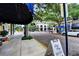 Streetscape featuring brick streets and a Hotel sign surrounded by lush greenery in a vibrant downtown area at 1821 Windsor Dr, Winter Park, FL 32789