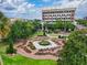 Beautiful town square featuring fountain, manicured gardens and surrounding buildings at 1821 Windsor Dr, Winter Park, FL 32789