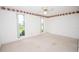 Bedroom with plush carpeting, a ceiling fan, and bright windows at 2 Pirates Cv, Ormond Beach, FL 32176