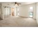 Bedroom with plush carpeting, pool views, and a view into an ensuite bathroom at 2 Pirates Cv, Ormond Beach, FL 32176