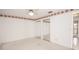 Empty bedroom with carpet, mirrored closet doors, and ceiling fan at 2 Pirates Cv, Ormond Beach, FL 32176