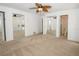Bedroom features plush carpeting, double closets with mirrored doors, and an ensuite bathroom at 2 Pirates Cv, Ormond Beach, FL 32176