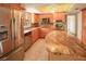 Stylish kitchen featuring stainless steel appliances, granite countertops, and custom cabinetry at 2 Pirates Cv, Ormond Beach, FL 32176