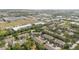 A suburban neighborhood featuring rooftops surrounded by lush greenery and commercial and residential areas at 2110 Stockton Dr, Sanford, FL 32771