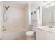 Bathroom with bathtub, shower, vanity, and built in toilet cabinet and mirror at 2110 Stockton Dr, Sanford, FL 32771