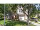 Charming two-story home with a well-manicured lawn and beautiful landscaping and attached garage at 2110 Stockton Dr, Sanford, FL 32771