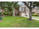 Charming townhome featuring a well-manicured lawn and two-car garage at 2110 Stockton Dr, Sanford, FL 32771