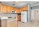 Efficient kitchen featuring essential appliances and a door to the rear of the property at 2110 Stockton Dr, Sanford, FL 32771