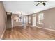 Bright open-concept living area with staircase, natural light, and modern flooring at 2110 Stockton Dr, Sanford, FL 32771