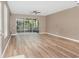 Large living area with modern floors and views of the private screened-in lanai at 2110 Stockton Dr, Sanford, FL 32771