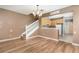 Cozy living space with staircase and an adjacent kitchen, with ample light at 2110 Stockton Dr, Sanford, FL 32771