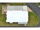 Aerial view of the home's roof and surrounding landscaping in a quiet neighborhood at 229 Rue De Fontaine, Tavares, FL 32778