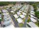 Extensive aerial view showcasing the entire community and its well-maintained streets at 229 Rue De Fontaine, Tavares, FL 32778