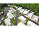 Aerial view showcasing the home's proximity to waterfront access and lush greenery at 229 Rue De Fontaine, Tavares, FL 32778