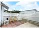 A view of the back yard with patio and fence, offering privacy and outdoor living at 229 Rue De Fontaine, Tavares, FL 32778