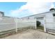 Exterior shot of the backyard with a privacy fence, showcasing a tranquil outdoor space at 229 Rue De Fontaine, Tavares, FL 32778