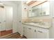 Bathroom with vanity, sink, and cabinets, providing ample storage at 229 Rue De Fontaine, Tavares, FL 32778