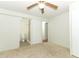 A bedroom with neutral carpet and an attached bathroom with a walk-in shower at 229 Rue De Fontaine, Tavares, FL 32778