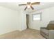 A bedroom featuring neutral carpet, a ceiling fan, and a closet for storage at 229 Rue De Fontaine, Tavares, FL 32778