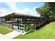 Covered boat dock and ramp provides access to the waterway for residents at 229 Rue De Fontaine, Tavares, FL 32778