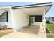 Carport of a home featuring a covered parking space and walkway at 229 Rue De Fontaine, Tavares, FL 32778