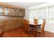 Cozy dining area with wood table, chairs, and built-in cabinets providing ample storage space at 229 Rue De Fontaine, Tavares, FL 32778