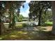 Scenic waterfront picnic area with a table for outdoor enjoyment at 229 Rue De Fontaine, Tavares, FL 32778