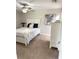 Bright bedroom with carpet floors, coastal decor, and a ceiling fan at 2299 Hawks Cove Cir, New Smyrna Beach, FL 32168