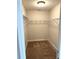 Walk-in closet with ample shelving and storage space at 2299 Hawks Cove Cir, New Smyrna Beach, FL 32168