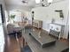 Open-concept living area featuring modern furniture, wood floors, and coastal-inspired accents at 2299 Hawks Cove Cir, New Smyrna Beach, FL 32168