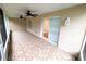Covered patio with tile flooring, ceiling fans, and outdoor lighting at 2299 Hawks Cove Cir, New Smyrna Beach, FL 32168