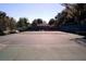 Community tennis court on a sunny day with clear lines and a surrounding fence at 2299 Hawks Cove Cir, New Smyrna Beach, FL 32168