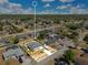 Wide aerial shot of a residential area, highlighting a property with a boat and a pool enclosure at 2397 Albury Ave, Deltona, FL 32738