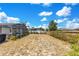 Spacious backyard with a screened pool area, offering privacy and room for outdoor enjoyment and relaxation at 2397 Albury Ave, Deltona, FL 32738