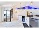 Bright kitchen with marbled tile flooring, stainless steel appliances and accent lighting at 2397 Albury Ave, Deltona, FL 32738