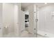 Ensuite bathroom featuring white tile shower with glass door, adjacent to main bedroom at 2949 Clever Ln, Winter Park, FL 32792
