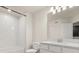 Bright bathroom features a shower-tub combo, large mirror, and stylish vanity at 2949 Clever Ln, Winter Park, FL 32792