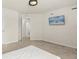 Clean bedroom with carpet floors, doorway to ensuite bath, and mounted TV on wall at 2949 Clever Ln, Winter Park, FL 32792