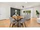 Bright dining area showcases a table with modern chairs with an open-concept living area at 2949 Clever Ln, Winter Park, FL 32792