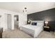 Nicely decorated main bedroom with carpet, panel accent wall, and modern light fixture at 2949 Clever Ln, Winter Park, FL 32792
