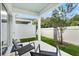 Comfortable patio with chairs provides a relaxing outdoor space with privacy fencing at 2949 Clever Ln, Winter Park, FL 32792