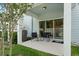 Cozy patio features seating and sliding glass doors offering seamless indoor-outdoor living at 2949 Clever Ln, Winter Park, FL 32792