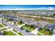 Community shot showing well-maintained homes in a suburban neighborhood with green spaces and roadways at 3216 Casa Del Rey Ave, Kissimmee, FL 34746