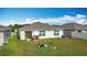 Aerial view of a cozy backyard with a small patio and green space, perfect for outdoor relaxation and gardening at 3216 Casa Del Rey Ave, Kissimmee, FL 34746