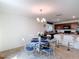Cozy dining area with seating for four adjacent to an open-concept kitchen at 3216 Casa Del Rey Ave, Kissimmee, FL 34746