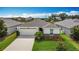 Charming one-story home with a two car garage, a well-manicured lawn, and tasteful landscaping at 3216 Casa Del Rey Ave, Kissimmee, FL 34746