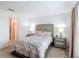 Bright main bedroom with neutral decor, a large bed and side tables at 3216 Casa Del Rey Ave, Kissimmee, FL 34746