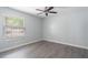Bedroom featuring gray walls, hard wood floors, one window and a ceiling fan at 352 Inglenook Cir, Winter Springs, FL 32708